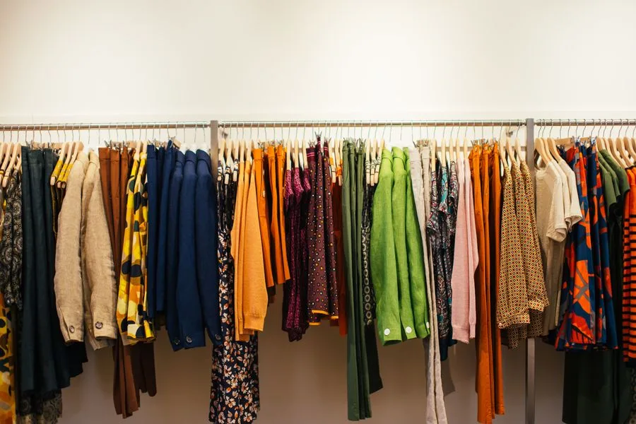 Colorful clothing on a boutique rack