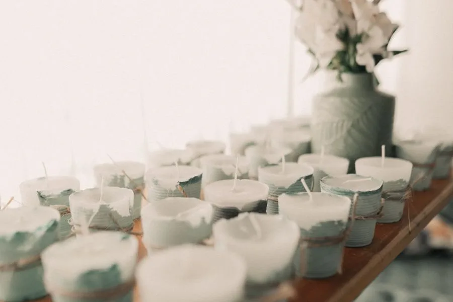 Candles and ceramics on wooden shelves